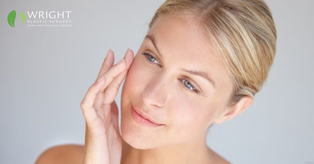 Blonde woman touching her face (MODEL)