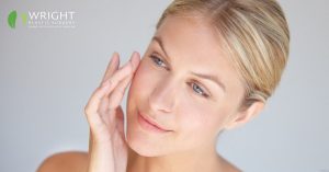 Blonde woman touching her face (MODEL)